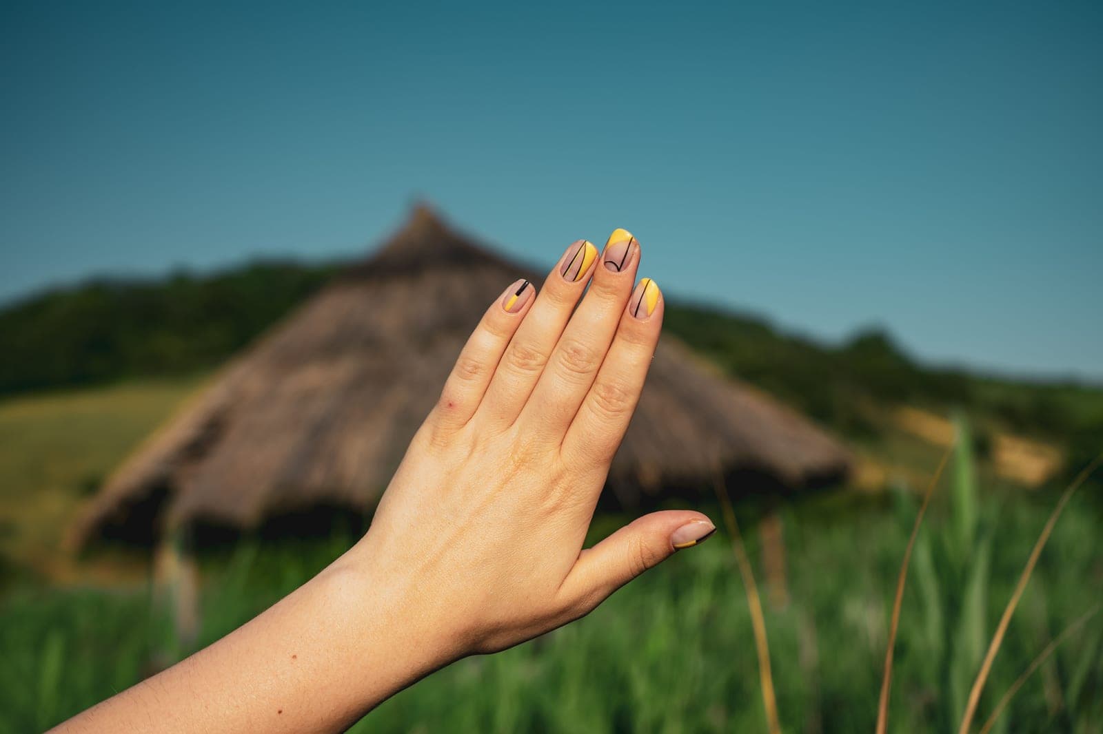 Short natural manicured nails on a hand — a category photo, not this product